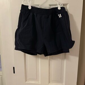 Peloton Double Layer Women’s Peloton Run Shorts Navy, Large. NWT